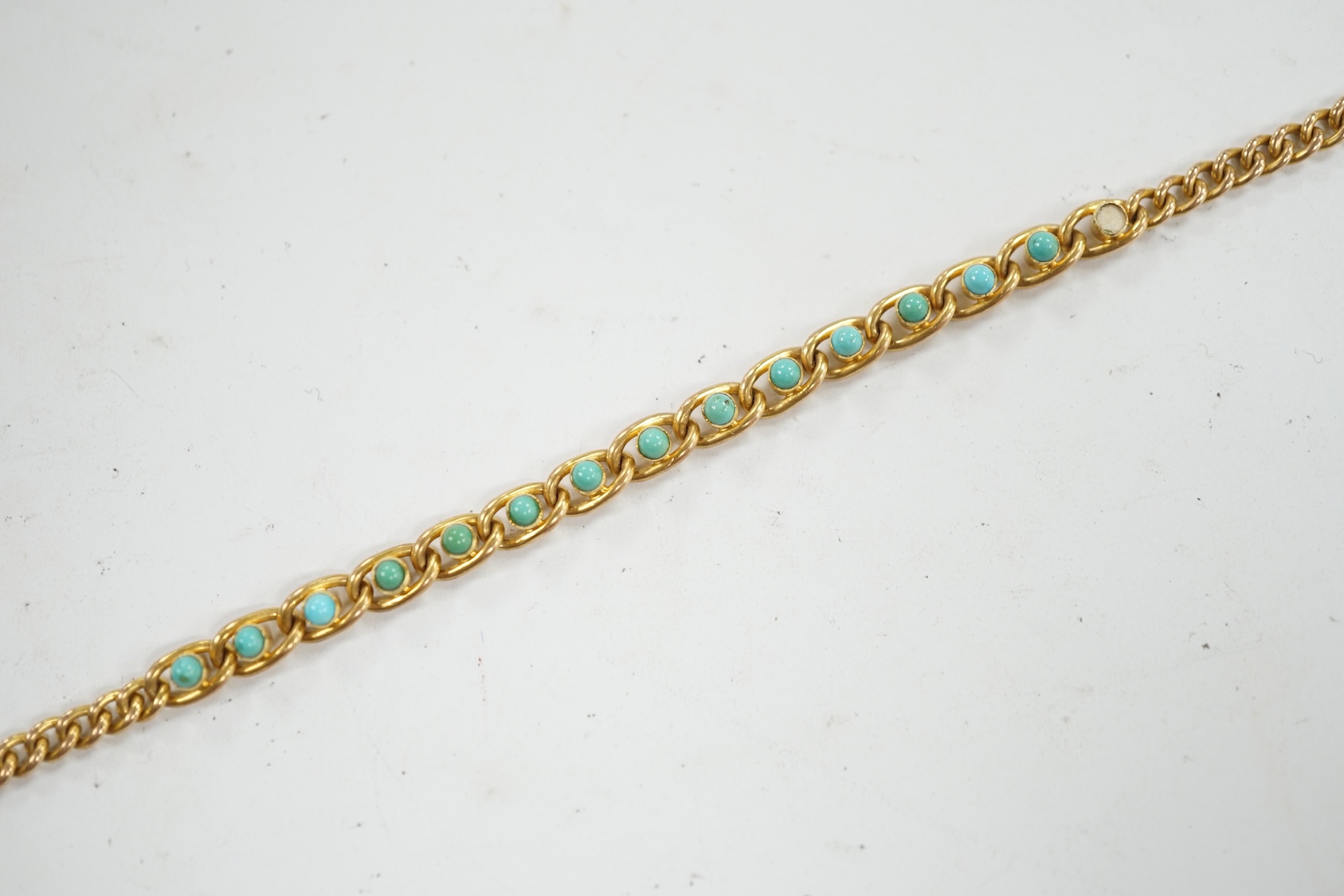 An Edwardian 15ct and turquoise set small curb and oval link bracelet, 17.5cm, stone missing, gross weight 8.1 grams. Condition - poor